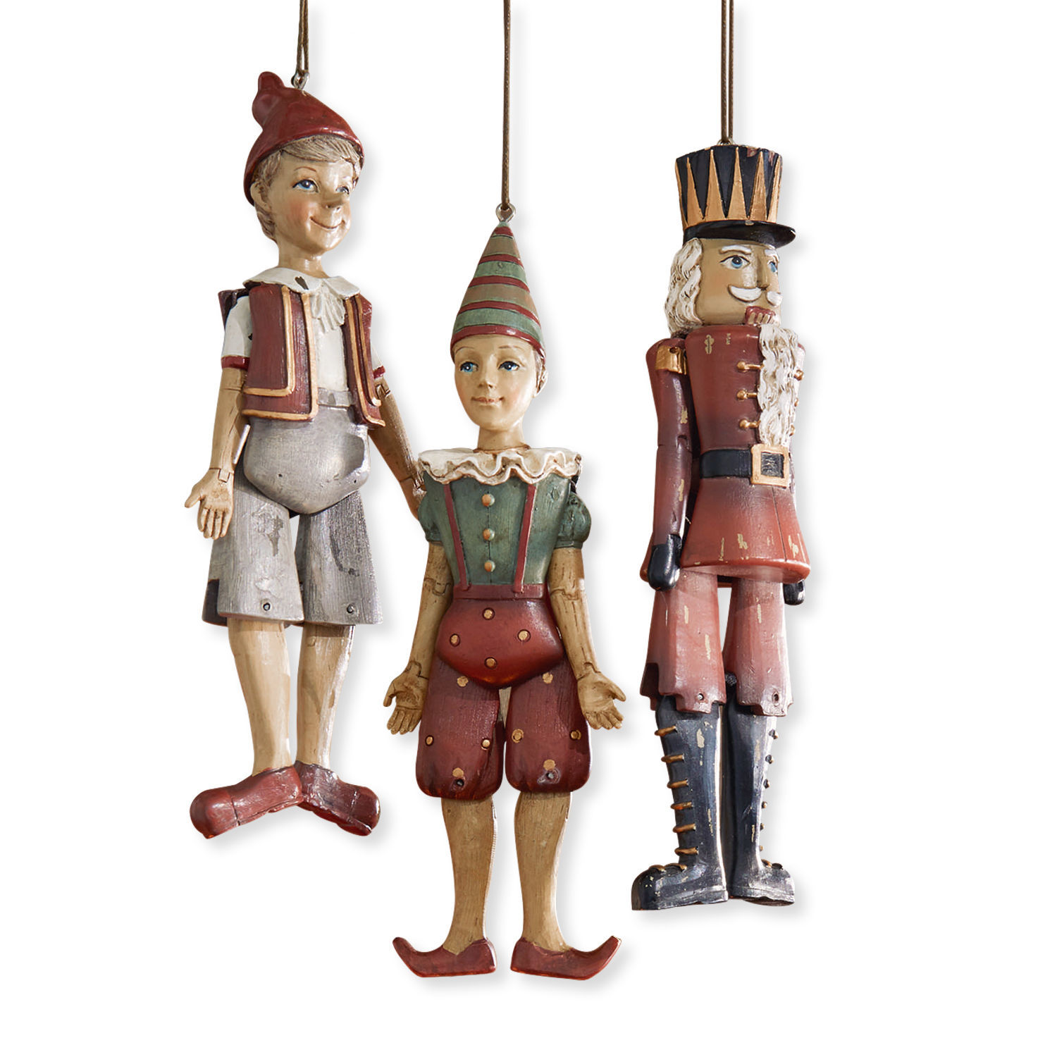 Figurky, 3dílná sada Udine Sada tří dřevěných vintage závěsných figurek: Pinocchio, klaun a voják v červené a zelené barvě