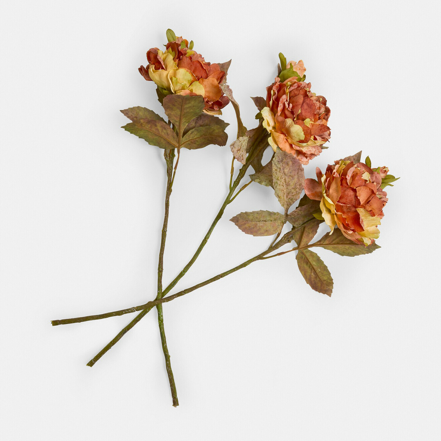 Dekorativní květiny, 3dílná sada Ambrayelle Tři umělé květiny v oranžových a žlutých odstínech se zelenými listy na bílém pozadí
